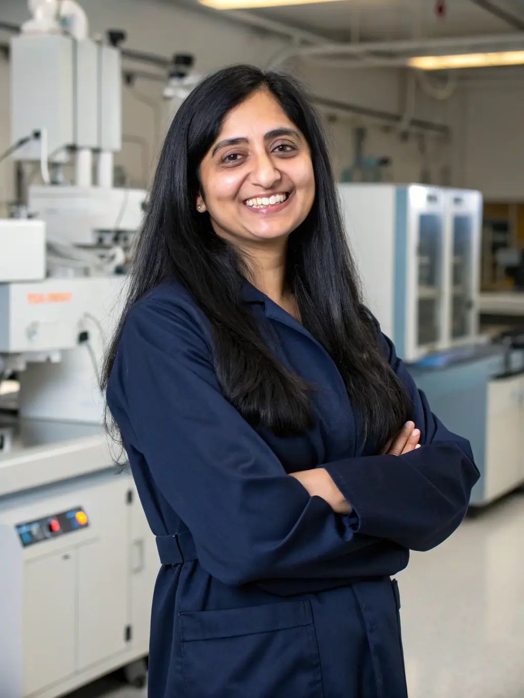 A professional headshot of Dr. Anya Sharma, a leading expert in organizational psychology, smiling confidently against a blurred background of a modern office setting. She is a keynote speaker at the FocusPro Leadership Conference.